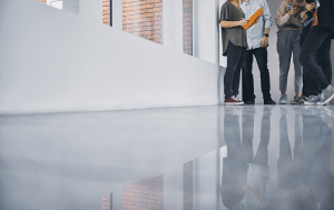 A floor-level shot of a polished concrete floor in a student hall.