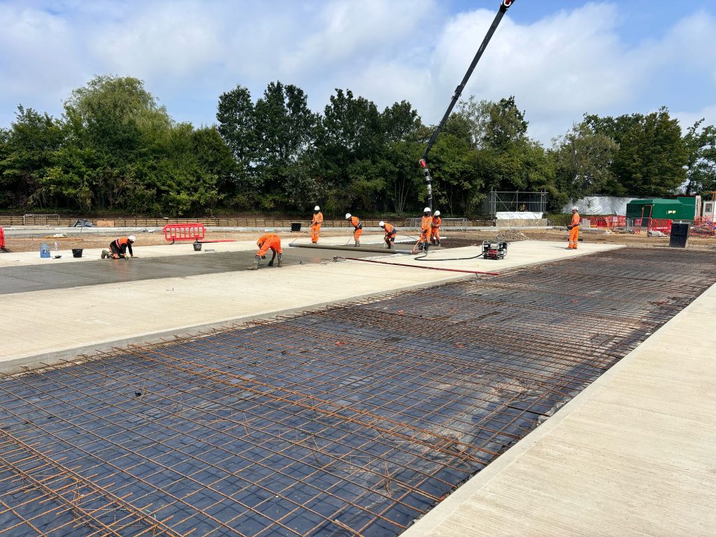 MKZ Construction's team working on laying a concrete installation