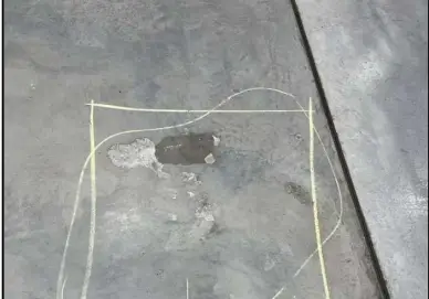 Photo of concrete floor delamination